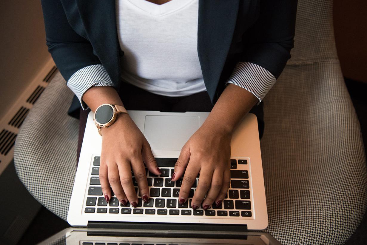 woman typing on a laptop